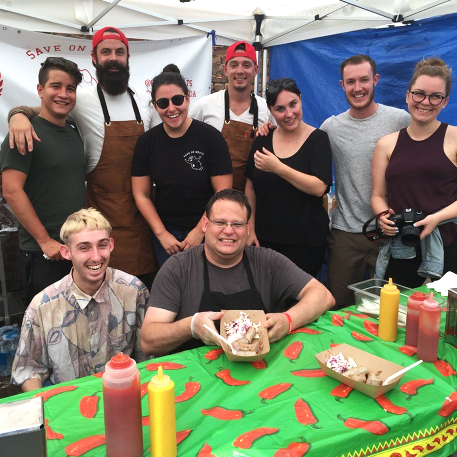 Save On Meats staff facilitating a BBQ at a DTES street market.