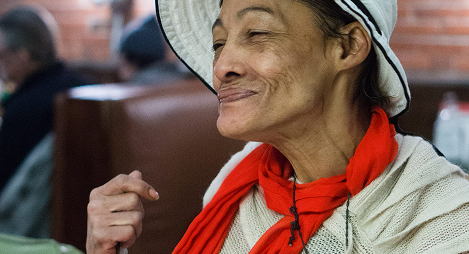 At-risk resident enjoying a meal in the warm, safe, dignified environment of Save On Meats during an A Better Life Foundation Plenty of Plates fundraising event.